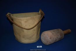 A large vintage wooden mallet possibly for stone masons and a canvas Bag with rope handle.