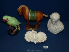 Four ceramic items including Oriental style horse (ears damaged), bust of Jesus,