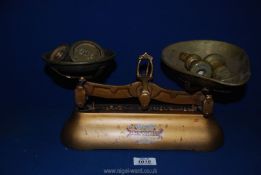 A J and J Siddons Ltd. weighing scales with weights.