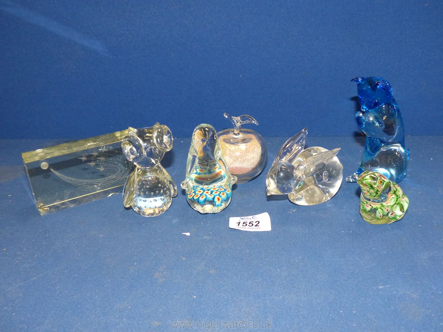 A quantity of animal glass paperweights including penguin, frog, rabbit etc., some chips.
