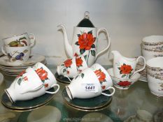 A Royal Albert coffee set in 'Tahiti' pattern comprising of coffee pot, six cups and saucers,