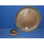 An antique Persian/Indian hammered tray and a small copper bowl.