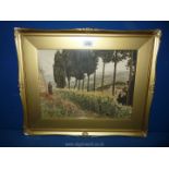 A gilt framed lithograph depicting a rural landscape with a monk reading a book,