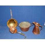 Four items including copper cooking pot, jug and ladle with brass handle and a brass skimmer.