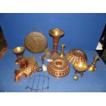 A quantity of brass and copper including copper moulds, old brass candlesticks, dinner gong etc.