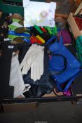 A box of new gardening equipment including forks and gloves, also including ladies handbags.
