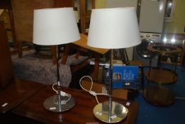 Two chrome based table lamps with shades.
