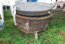 An old cast iron Water Boiler with tap, 15 & 20 gallons, for wood or coal.