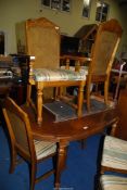 An extending Dining Table with spare leaf,