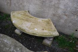 An arch shaped concrete bench with squirrel/animal pillars, 40" wide x 18" high.