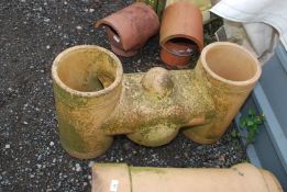 A large "H" shaped terracotta chimney pot.