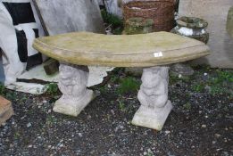 A concrete bench with squirrel/animal pillars, 40" wide x 18" high.