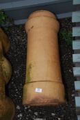 A terracotta chimney pot (hairline crack).