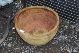 A terracotta round planter, 15 1/2" wide x 8" high.