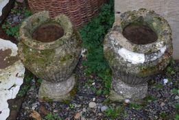 A pair of concrete urns (damaged), 17" high.