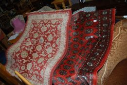 Two bordered and patterned rugs, 60'' x 47'' and 58'' x 37 1/2''.