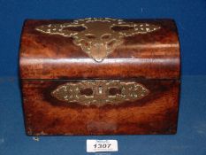 A dome topped Walnut wood Caddy with ornate brass detail to the lid, interior a/f,