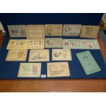 A box of 'Wills' and 'Players' cigarette card albums (12 complete).