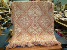 A large Throw in cream and orange, 98'' x 68''.