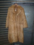 A full length rabbit fur Coat, gold coloured lining, size 14.