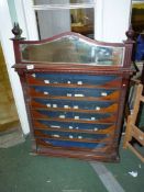 A glass fronted circa 1920's Mahogany countertop Cigarette Dispensing Cabinet with side drawers,