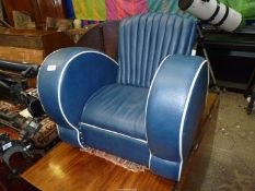 A faux leather Art Deco style child's armchair, 22" tall x 24" long.