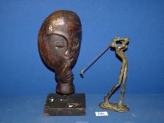 A bronze effect statue of Golfer, 10'' tall and African Tribal mask, 13'' tall.