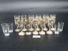 Eleven sterling silver 925 encased glass shot Glasses decorated with thorns and roses,