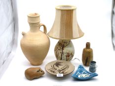 A quantity of pottery items including table lamp, ewer, guinea pig, ashtray etc.
