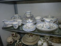 A six setting of Royal Doulton 'Coniston' dinnerware and teaware including; dinner plates,