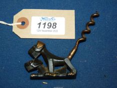 A collectible 1920's Art Deco metal Corkscrew cast as two naughty Scottie dogs,