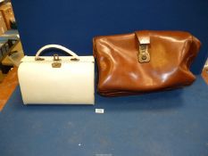 A brown leather Briefcase and cream Vanity cases, a/f.
