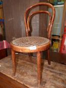 A child's bentwood cafe Chair with rattan seat, a/f.