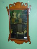 A fretwork wall Mirror by Coopers of King St., Gravesend, 25 1/2'' x 15''.