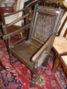 A Wainscot type open armed elbow Chair of peg-joyned construction,