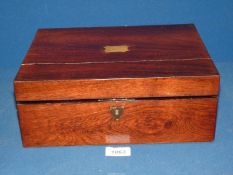 A 19th century rosewood writing Slope with brass escutcheon, 9" x 12".