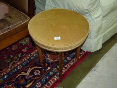 A 19th century light Mahogany circular Stool with over-stuffed horse hair seat upholstered in