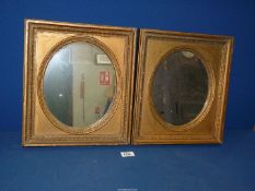A pair of rectangular gold painted wooden mirrors, 12" x 13 1/2".
