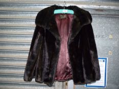 A Tissavel brown faux fur short Jacket with satin lining.