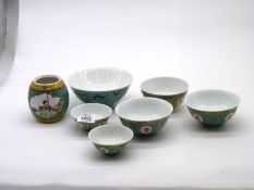 Six Chinese porcelain bowls decorated in turquoise, yellow, red and blue with Eastern designs,