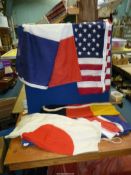 Five large fabric flags; France, USA, Japan, Germany, etc.