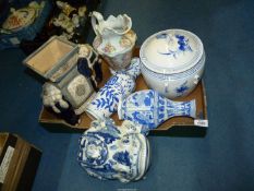 A large Elephant plant stand together with oriental blue and white vases, large lidded pot,