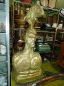 A large carved bust of a Gladiator, gold painted, 36'' tall x 16'' wide.