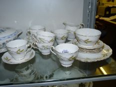 A part Royal Standard 'Symphony' Teaset including six cups, saucers and tea plates, sugar basin,
