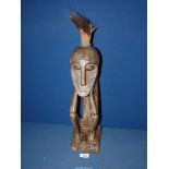 A carved African figure, 18" tall.