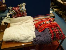 Two large cream throws, two travel rugs, hand crocheted blanket, etc.