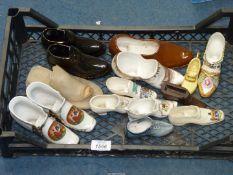 A quantity of china shoes to include Crested ware, pair of 'Welsh ladies',