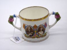 A boxed 'Silver Jubilee 1910-1935' two handled cup.