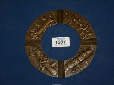 An unusual bronze Roundel, cast with a sequence of detailed industrial scenes,