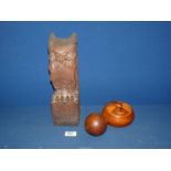 A carved Owl, possibly the finial off a banister, 12 1/2" tall, plus a treen lidded dish.